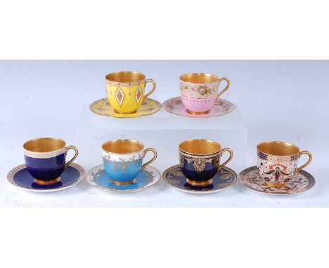 Six various early 20th century Royal Worcester porcelain miniature teacups and saucers, all having gilded interiors, all piec