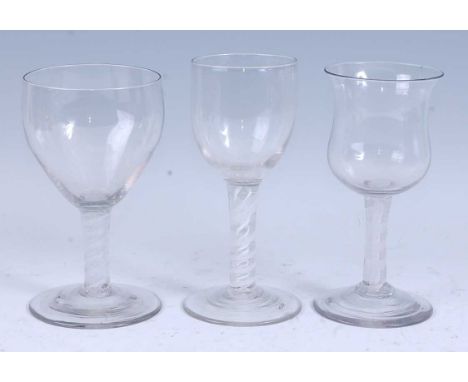 * A circa 1765 wine glass, the large waisted bell shaped bowl above a double series opaque twist stem and standing upon a sli