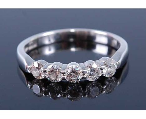 A platinum 'Hearts on Fire' diamond half hoop eternity ring, comprising five round brilliant cut diamonds in claw settings, d