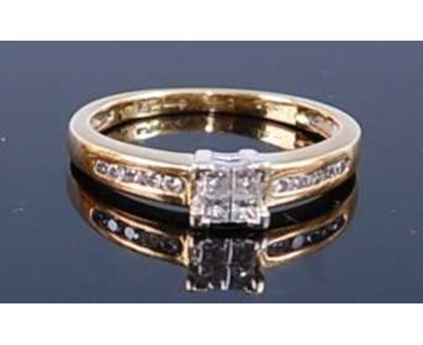 An 18ct yellow and white gold Princess cut diamond ring, featuring four invisible set 1.8mm Princess cut diamonds, with five 