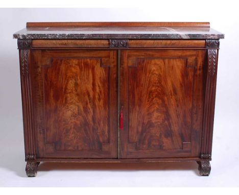 A Regency mahogany and marble topped fitted chiffonier, the veined rouge marble having a reeded edge and above twin recessed 