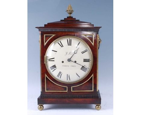 J Rix of Charing Cross - a Regency mahogany bracket clock, the case having a stepped cornice with brass pineapple finial, lio