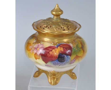 A George VI Royal Worcester porcelain blush ivory footed pot pourri jar and cover, of lobed bulbous form with pierced gilded 