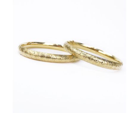 Pair of Vintage 14 Karat Yellow Gold Hinged Bangle Bracelets. Stamped 14K. Approx. weight: 17.9 grams. Shipping $30.00 (estim