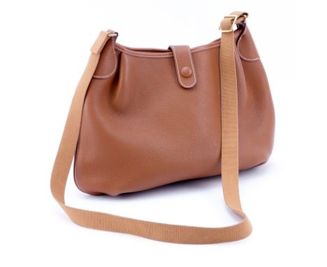 Hermes Brown Leather Cross Body Hobo Bag. Canvas strap, unlined, snap closure with perorated H icon snap closure. Printed lab
