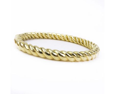 Vintage Italian 14 Karat Yellow Gold Hinged Bangle Bracelet. Stamped 14K. Good condition. Measures 2-1/2" interior diam., 1/4