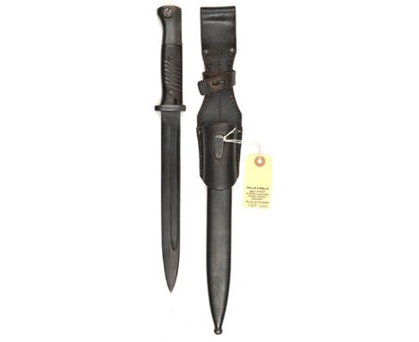 A good WWII German K98 bayonet, in scabbard, with frog, matching nos 8281 to blade and scabbard. Near VGC with most original 