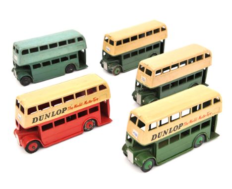 5 Dinky Toys double deck buses. An early post WW11 example with AEC grille with cutaway wings, in two tone green with black w