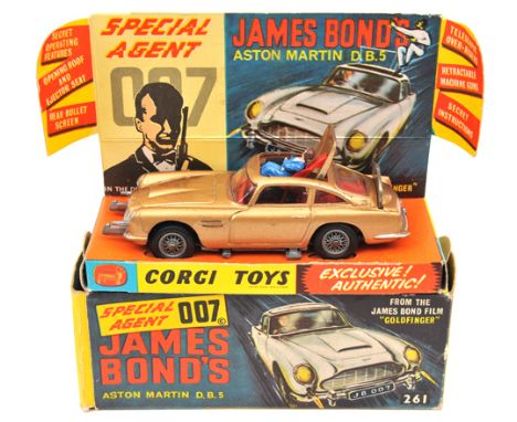 Corgi Toys James Bond’s Aston Martin DB5 (261) In metallic gold, with red interior. Boxed-light wear, complete with display i