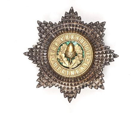 An officer’s gilt and silver plated star forage cap badge of The Cheshire Regt, green enamel centre, marked J & Co. Near VGC.