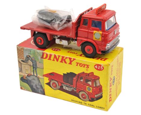 A Dinky Bedford TK Coal Lorry (425). In red “Hall & Co” livery, with silver chassis, late example with red plastic wheels. Co