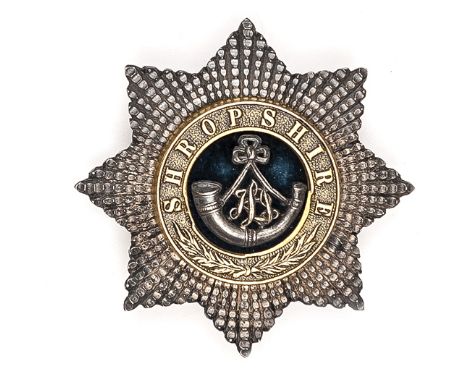 An officer’s gilt and silver plated star puggaree badge of The King’s (Shropshire Light Infantry), black cloth to centre with