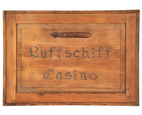 A pine advertising board, with a relief representation of an airship, and carved in Gothic script “Luftschiff Casino”, with m