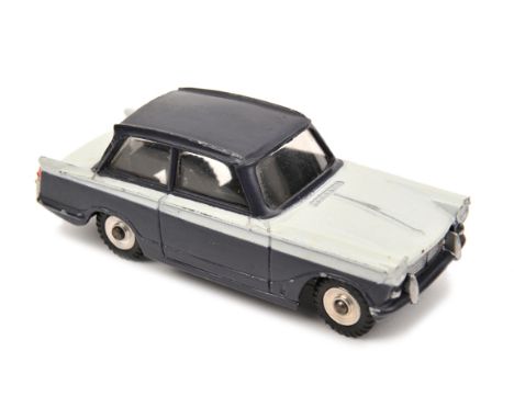 A rare Dinky Toys promotional Triumph Herald (189). An example in white with Monaco blue roof and lower sides. With spun whee