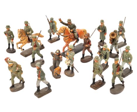 17 Lineol, Elastolin etc composition German toy soldiers. Most pre WW11 infantry, including 2 mounted, one jumping, wounded b