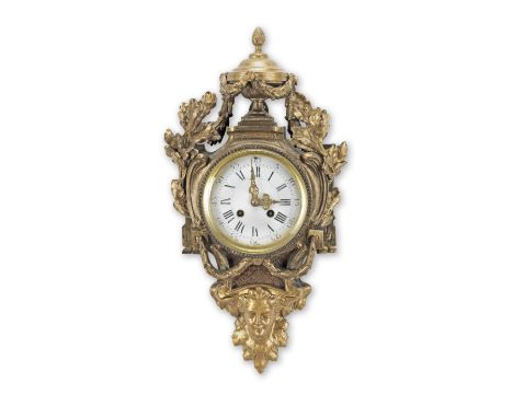 A Louis XVI style ormolu cartel clock19th centuryThe white enamel dial with Roman and Arabic numerals flanked by oak leaf gar