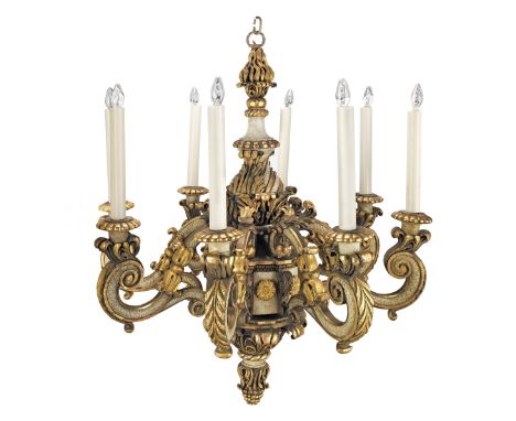 A large Italian carved giltwood and painted eight light chandelier19th century With scrolled candle arms, later adapted to el