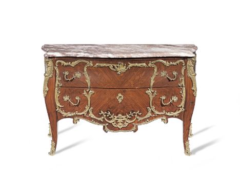 A Louis XV style ormolu-mounted rosewood and marquetry commode20th centuryThe pink marble top above bombe body with two drawe