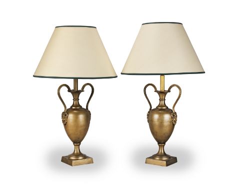 A pair of brass twin handled lamp bases in the 19th Centuy styleThe slender ovoid bodies with high scrolling mask head handle