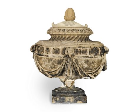 A Coade stone urn and coverLate 18th / early 19th century The later cover and finial above a twisted fluted neck and  a borde