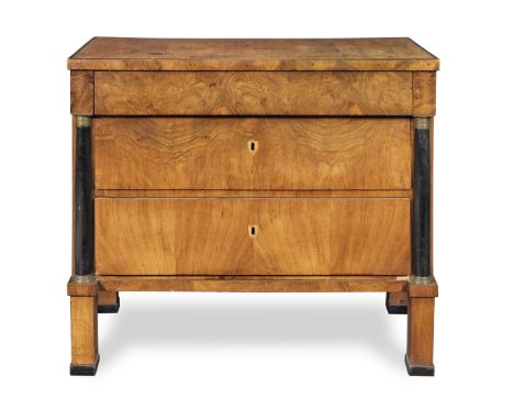 A Small Biedermeier walnut and ebonised commode19th century With a frieze drawer above two further long drawers flanked by co