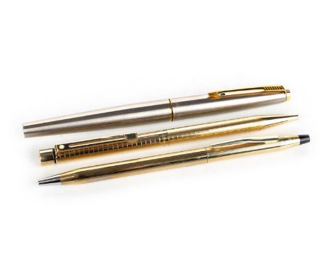 THREE PENS, comprising gold-plated Cross ballpoint with original box, gold-plated Sheaffer ballpoint, brushed steel Parker fo