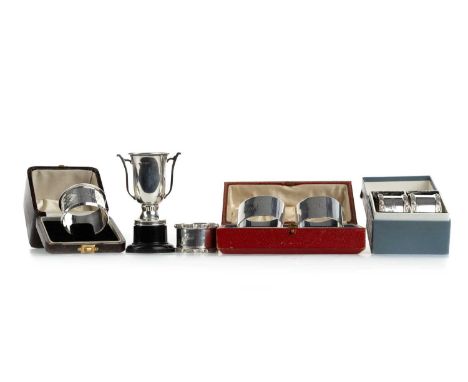 SIX SILVER NAPKIN RINGS, VARIOUS MAKERS AND ASSAYS comprising two boxed pairs and two singles (one boxed), also a silver trop