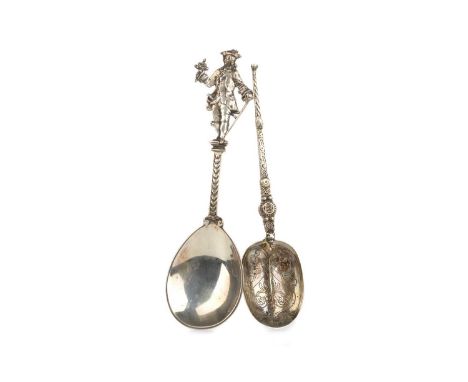 TWO SILVER SPOONS, one with figural finial, the other bearing inscription, dated 6.3.14largest 18cm longQty: 117g