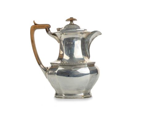 ELIZABETH II SILVER COFFEE POT, COOPER BROTHERS, SHEFFIELD 1958 of octagonal baluster form, with wooden handle and finial20cm