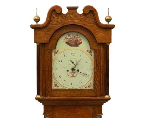 CIRCA 1900 LONGCASE CLOCK in oak having a painted dial with arched top, eight day movement by John Winstanley of Holywell, pe