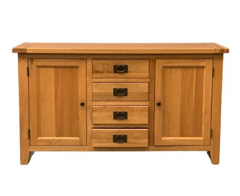 MODERN LIGHT OAK SIDEBOARD, four drawers flanked by two end cupboards, 85cms H, 150cms W, 45cms D