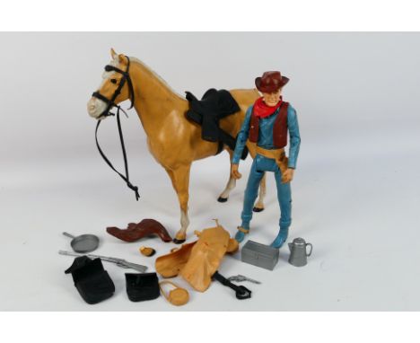 Johnny West - An unboxed vintage Johnny West Cowboy Kit comprising of a 12" cowboy poseable action figure with accessories. S