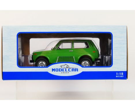 Model Car Group - A boxed Model Car Group #MCG1811 1:18 scale Lada Niva. The model in green appears to be in Mint condition, 