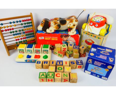 Fisher Price - Yumi - Avon Toys - Early Years - A collection of 5 early years toys including three which are boxed; a Snoopy 