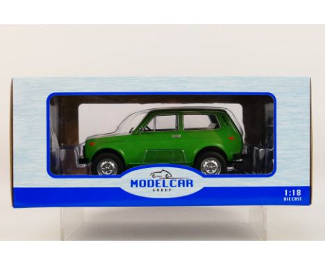 Model Car Group - A boxed Model Car Group #MCG1811 1:18 scale Lada Niva. The model in green appears to be in Mint condition, 