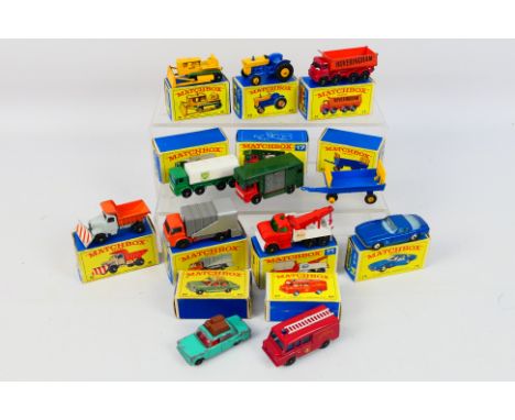 Matchbox - 12 x boxed models including Ford Tractor # 39, Hay Trailer # 40, Caterpillar Dozer # 18, Ford Wreck Truck # 71 and