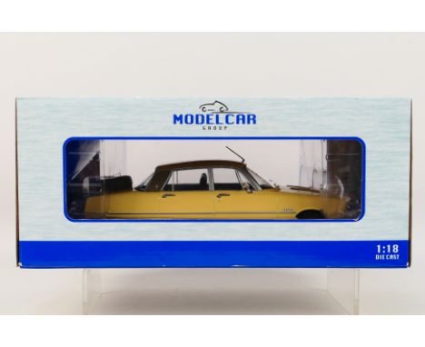 Model Car Group - A boxed 1:18 scale Model Car Group MCG209972 1974 Rover 3500 V8. The model in dark yellow appears to be in 