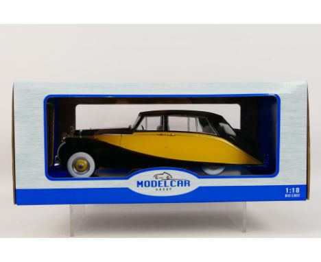 Model Car Group - A boxed Model Car Group #MCG18066 1:18 scale Rolls Royce Silver Wraith. The model in two tone yellow and bl