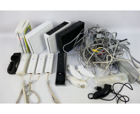 Nintendo - Three unboxed Nintendo Wii console with a couple of games and several unboxed Wii themed accessories. Items all sh