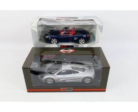 UT Models - Two boxed 1:18 scale diecast model cars from UT Models, comprising of #727635 Porsche Boxster S; together with #7