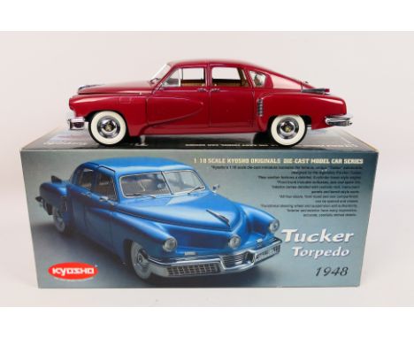 Kyosho - A boxed Kyosho 'Originals' #08201R 1948 Tucker Torpedo. The model in red, has some storage induced paint rash to a f