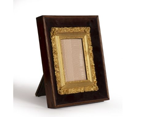 A LATE 19TH CENTURY GILT GESSO PORTRAIT MINIATURE FRAME, the border moulded with trailing vines, berries and fluted pilasters