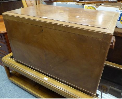 An Art Deco trunk, the hinged cover inlaid with the initial B, on a green baize lined interior 