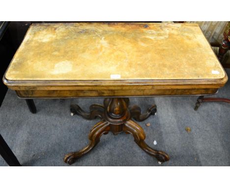 A Victorian walnut fold over card table on cabriole supports 