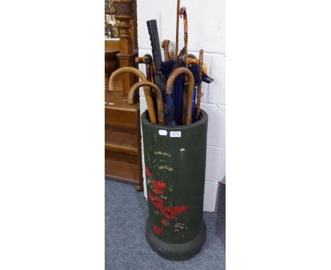 A quantity of various walking sticks, parasols, umbrellas etc, including a silver mounted example with tiger's eye handle, in