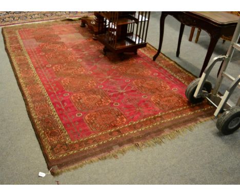 An Ersari carpet, North Afghanistan, the claret field with columns of elephant foot guls, 288cm by 190cm