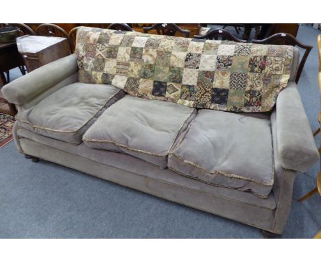 An early 20th century three seat sofa of generous proportions 