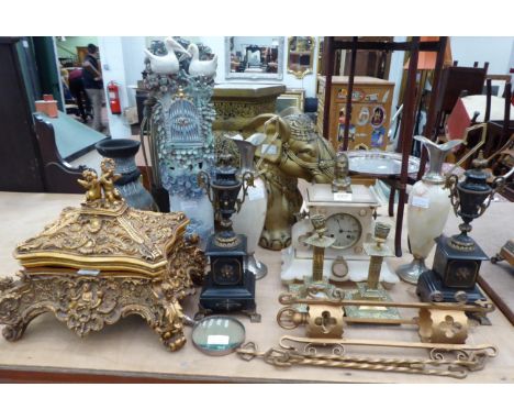 Pair of metal mounted black slate urns; pair of brass candlesticks; decorative composition table box; onyx mantel clock; pair