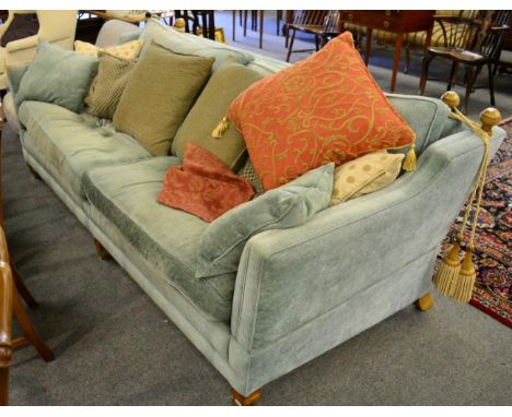 A large Duresta knoll type three seater sofa, blue upholstery, drop end, square supports to castors