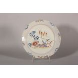 An 18th century Lambeth delft shallow dish with polychrome tree and fence decoration, 8 5/8" dia (